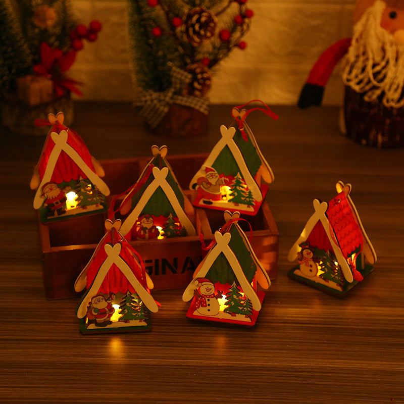 Colorful wooden Christmas houses toys and glowing festive gifts