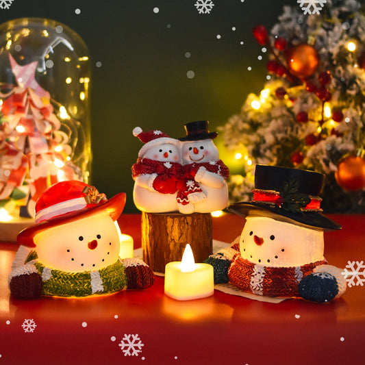 Creative Christmas decorations with snowmen, small animals and Christmas trees