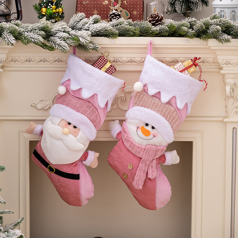 Nordic style pink Santa Claus Christmas socks used as gift bags and festive decorations